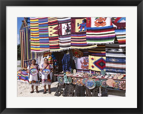 Framed Two female vendors dressed in Mayan costumes displaying products Print