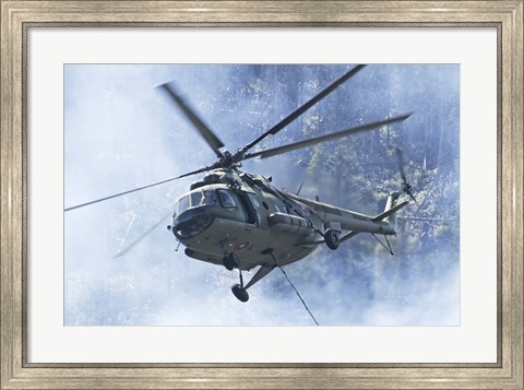 Framed Bulgarian Air Force Mi-17 helicopter over a forest fire in Bulgaria Print