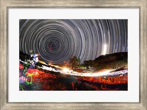 Framed Astronomers observe polar star trails above a mountain in Iran Print