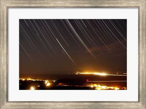 Framed Star trails above a village in the central desert of Iran Print