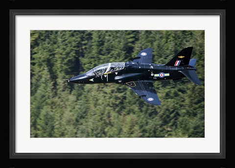 Framed Hawk T1 trainer aircraft of the Royal Air Force flying over a forest in North Wales Print