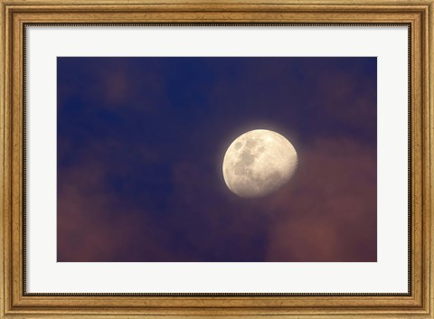 Framed moon between colorful clouds at sunset Print