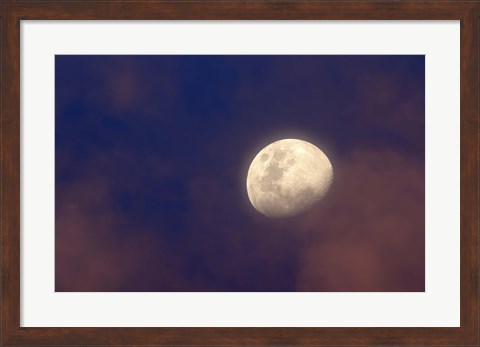 Framed moon between colorful clouds at sunset Print