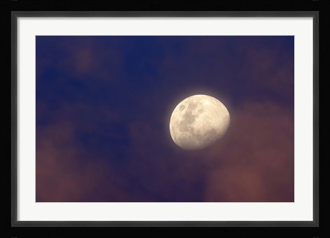 Framed moon between colorful clouds at sunset Print