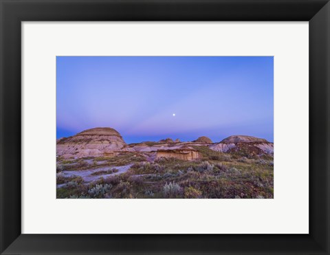 Framed Gibbous moon and crepuscular rays over Dinosaur Provincial Park, Canada Print