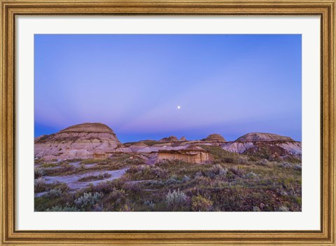 Framed Gibbous moon and crepuscular rays over Dinosaur Provincial Park, Canada Print