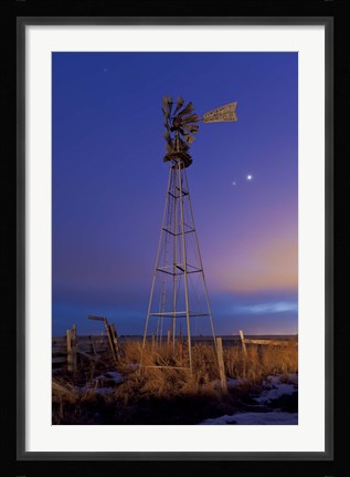 Framed Venus and Jupiter are visible behind an old farm water pump windmill, Alberta, Canada Print