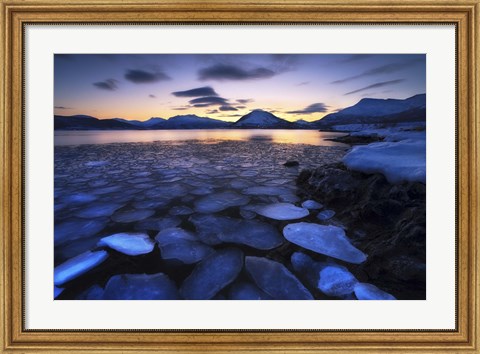 Framed Ice flakes drifting against the sunset in Tjeldsundet strait, Troms County, Norway Print