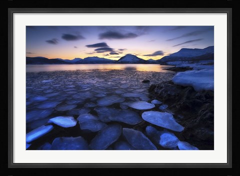 Framed Ice flakes drifting against the sunset in Tjeldsundet strait, Troms County, Norway Print