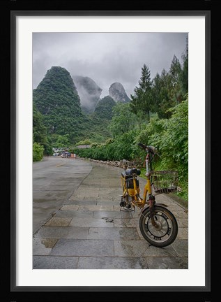 Framed Bicycle sits in front of the Guilin Mountains, Guilin, Yangshuo, China Print