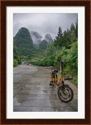 Framed Bicycle sits in front of the Guilin Mountains, Guilin, Yangshuo, China Print