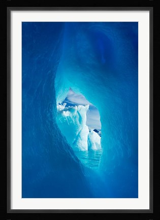 Framed Antarctica, Iceberg framed in arch of another in Wilhelmina Bay. Print