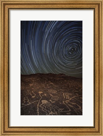 Framed Star trails at an ancient petroglyph site near Bishop, California Print