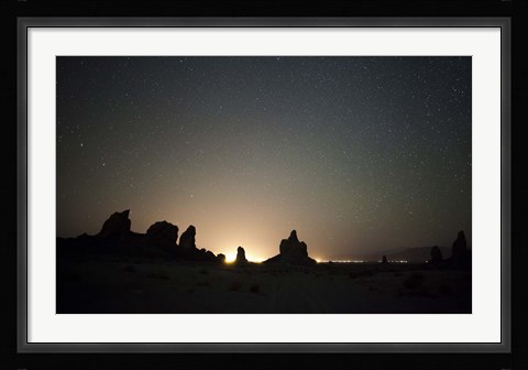 Framed Large tufa formations at Trona Pinnacles against a backdrop of stars Print