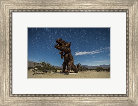 Framed Tyrannosaurus rex sculpture against a backdrop of star trails, California Print