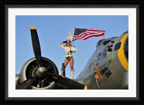 Framed 1940's style majorette pin-up girl on a B-17 bomber with an American flag Print