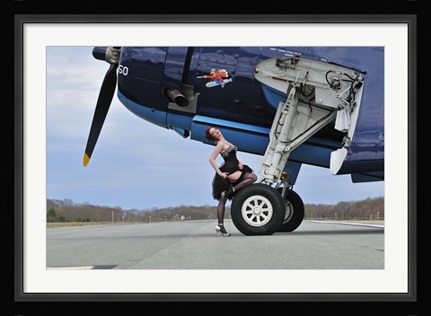 Framed 1940's style pin-up girl resting on the wheel of a TBM Avenger Print