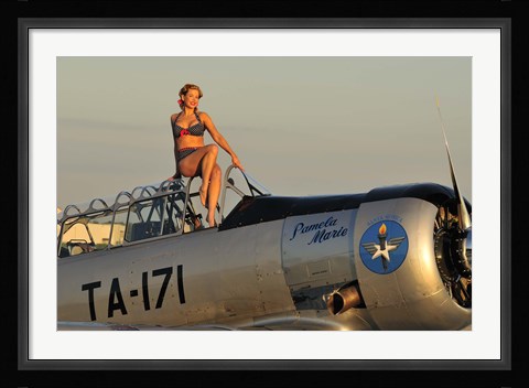 Framed 1940's style pin-up girl sitting on the cockpit of a World War II T-6 Texan Print