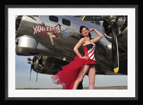 Framed Beautiful 1940's style pin-up girl standing under a B-17 bomber Print