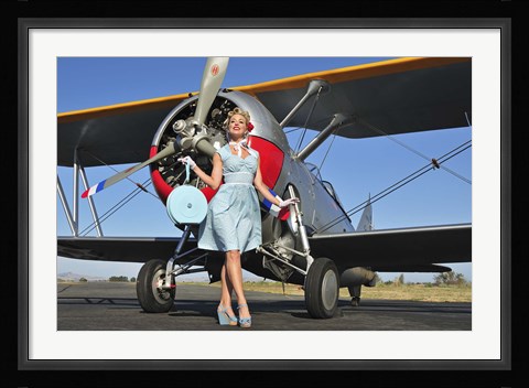 Framed Elegant 1940's style pin-up girl standing in front of an F3F biplane Print