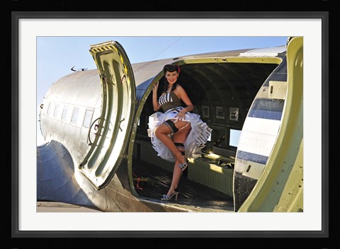 Framed Sexy 1940's style pin-up girl standing inside of a C-47 Skytrain aircraft Print