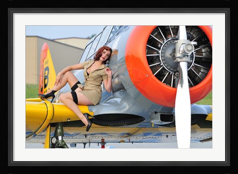 Framed 1940's style pin-up girl posing on a T-6 aircraft Print