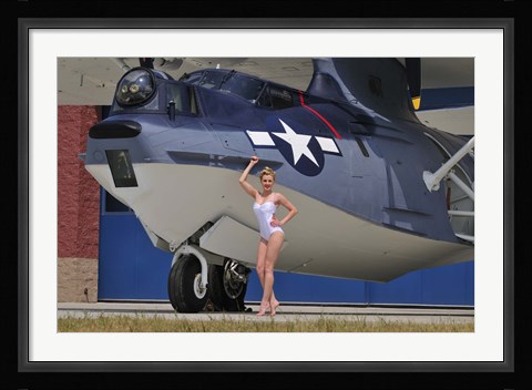 Framed pin-up girl posing with a Catalina seaplane Print