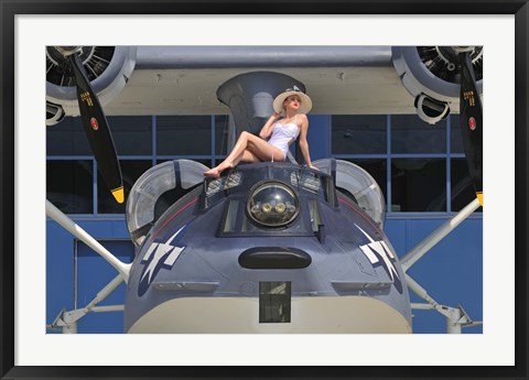 Framed Retro pin-up girl posing with a World War II era PBY Catalina seaplane Print