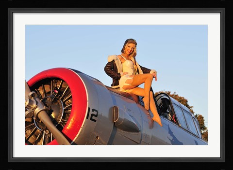 Framed 1940's style aviator pin-up girl posing with a vintage T-6 Texan aircraft Print