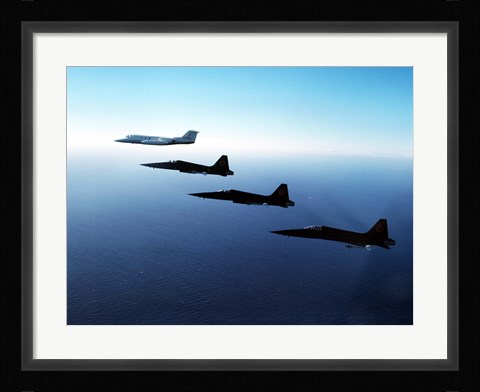 Framed Three F-5E Tiger IIs fly in formation with a Learjet 25 Print