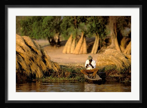 Framed Local Man Fishing and Piles of Straw for Hatch, Okavango Delta, Botswana Print