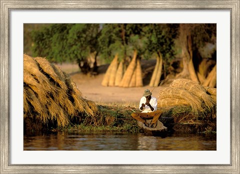 Framed Local Man Fishing and Piles of Straw for Hatch, Okavango Delta, Botswana Print