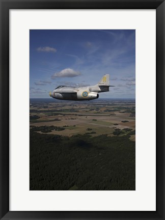 Framed Saab J 29 jet fighter flying over landscape Print