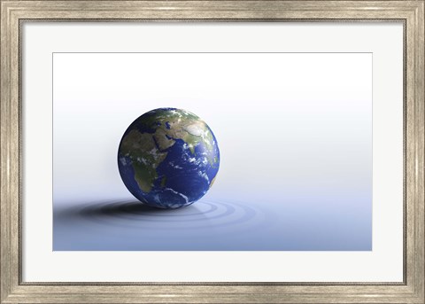 Framed Planet Earth on a blue floor Print