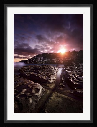 Framed Rocky shore and tranquil sea against cloudy sky at sunset, Sardinia, Italy Print