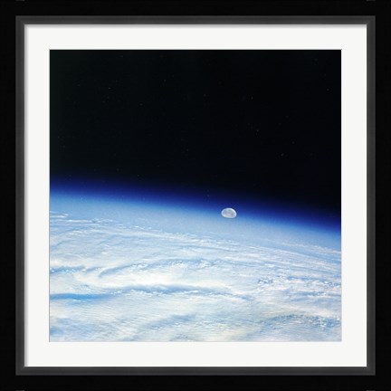 Framed Outer space shot of storm system in early stage of formation with moon in background Print