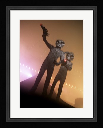 Framed Alien Aiming a Gun Print