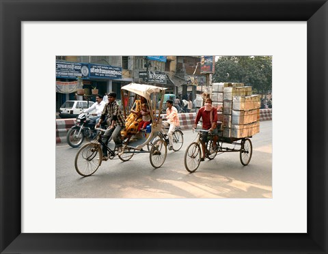 Framed People and cargo move through streets via rickshaw, Varanasi, India Print