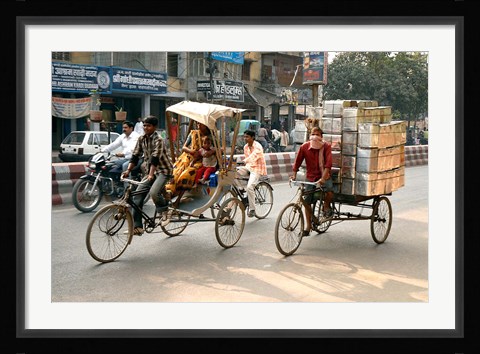 Framed People and cargo move through streets via rickshaw, Varanasi, India Print