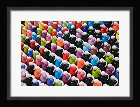 Framed Pattern of glass figures hugging. Outdoor market, Bangkok, Thailand Print