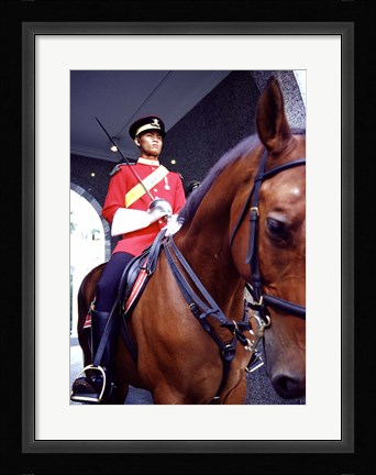 Framed Malaysia, Kuala Lumpur: a mounted guard stands in front of the Royal Palace Print