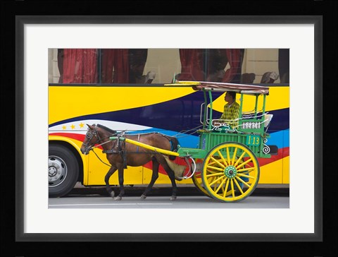 Framed Horse cart walk by colorfully painted bus, Manila, Philippines Print