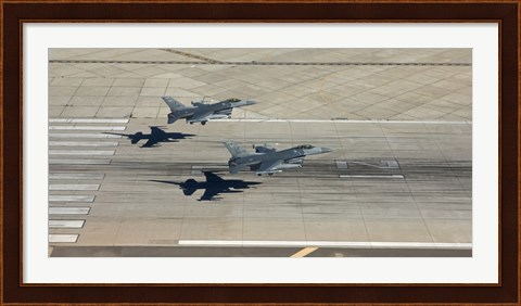 Framed Two F-16&#39;s Land in Formation at Luke Air Force Base, Arizona Print