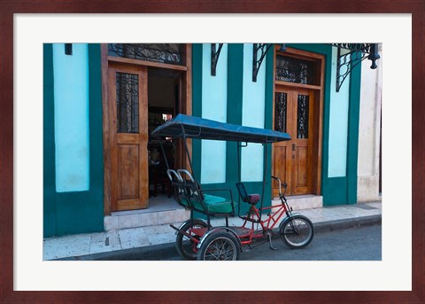 Framed Cuba, Camaquey, bike carriage and buildings Print