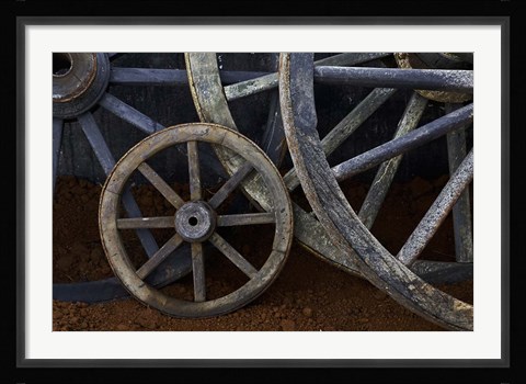 Framed Rustic wagon wheels on movie set, Cuba Print