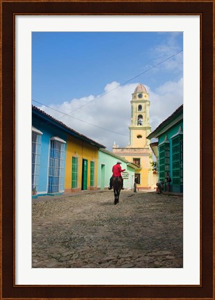 Framed Cobblestone street with cowboy on horse, Trinidad, Cuba Print