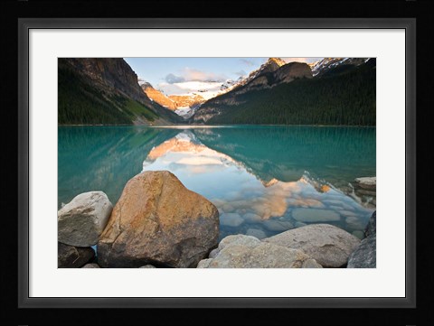 Framed Rocky Mountains and boulders reflected in Lake Louise, Banff National Park, Alberta, Canada Print