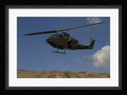 Framed AH-1F Tzefa of the Israeli Air Force flying over the Golan Heights, Israel Print