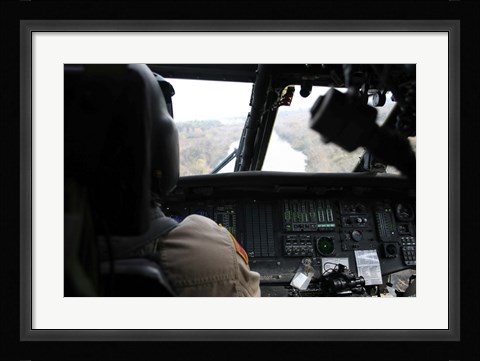 Framed UH-60 Blackhawk flies the River to an Unknown Village to Drop off a Care Package Print