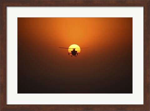 Framed AH-64D Apache Helicopter Flying into the Sun over Iraq Print